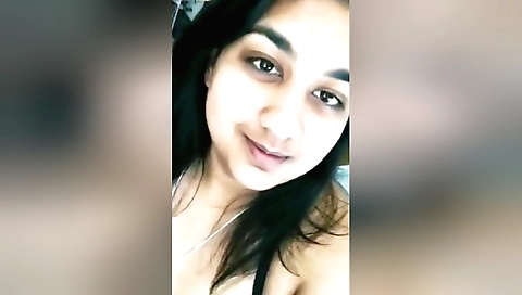 Hot brunette with a small boobs shows her face in webcams