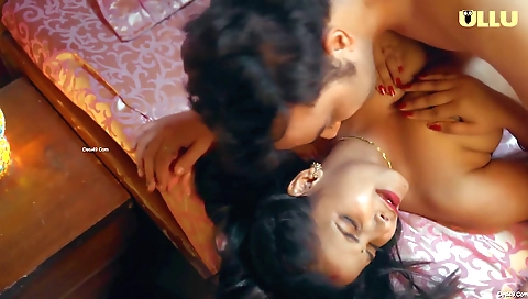 Brunette with huge boobs is stretching on her feet