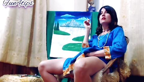 A hot brunette is smoking in her naked body on the web camera