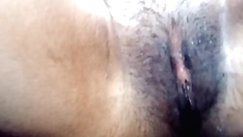 Indian girl with a hairy pussy fucks her hairy pussy