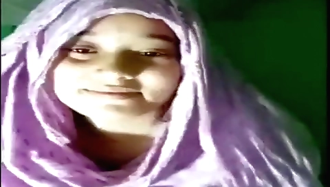 Sexy brunette in a red dress is fingering her pussy