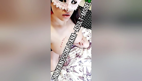 Brunette with large tits is naked and masturbating