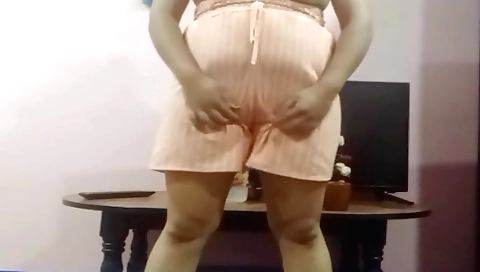 Hot chick in a bikini spreads her legs in front of the camera