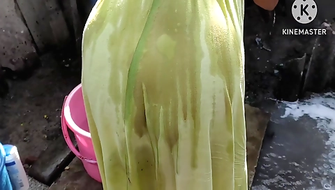 A blonde woman is soaking wet in hot water and bathing her body