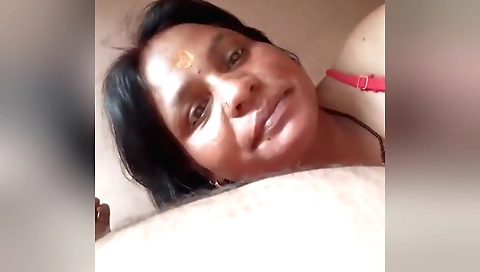 Indian brunette milf is giving a blowjob to her boyfriend