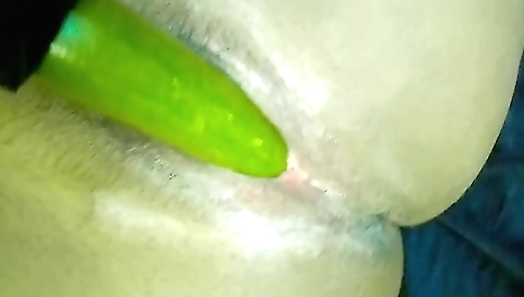 Female in a homemade solo vid masturbating with a plastic cucumber