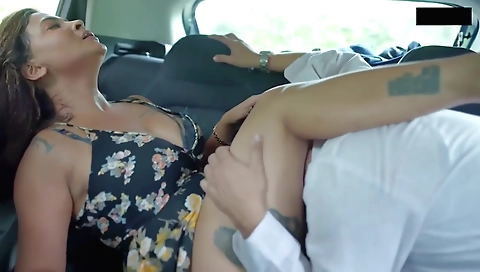 Busty mature lady with a sexy body is wearing a dress