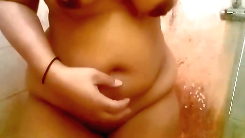 Shy indian chick takes a shower and rubs her pussy