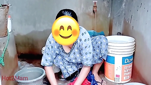 Sexy brunette in red dress and stockings seduces herself in bed