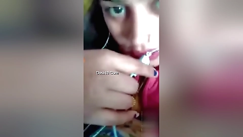 Horny brunette in a huge breast cup showing her pussy